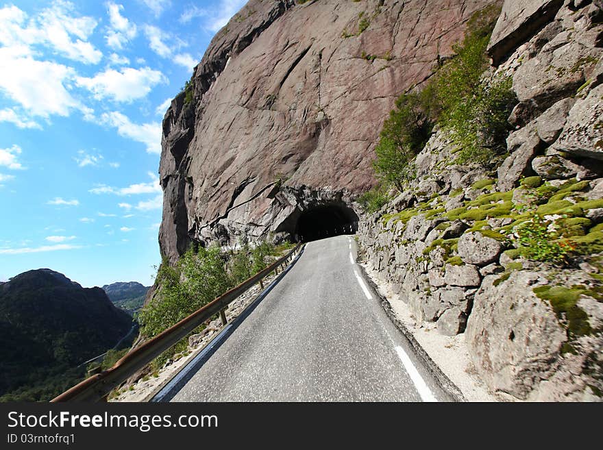 Tunnel cut into mountain, road pass