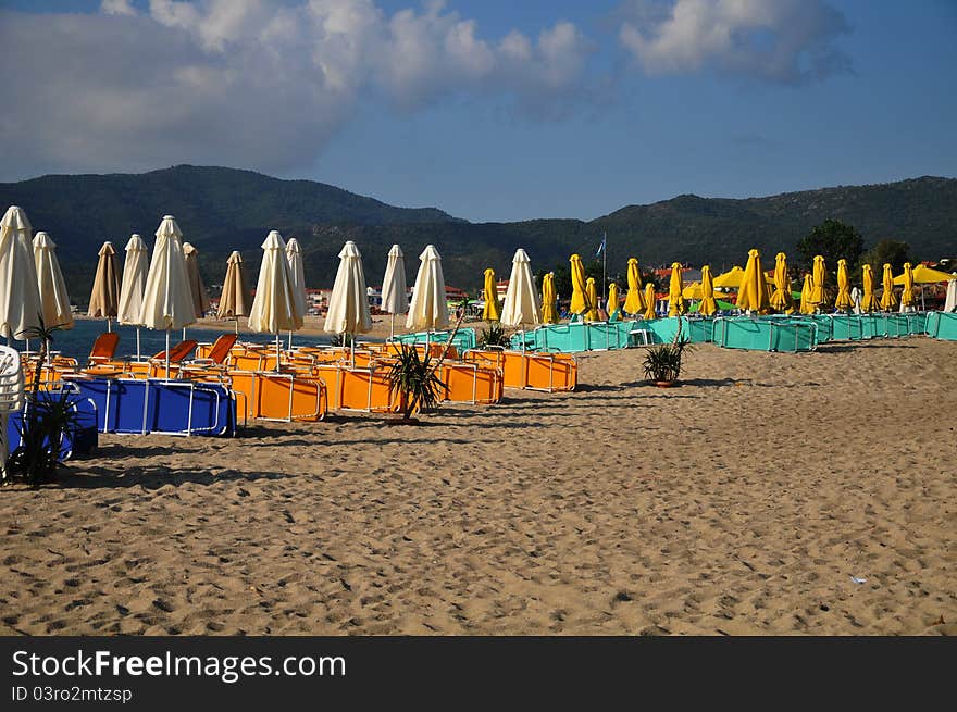 Umbrellas and deck chairs on the sandy beach