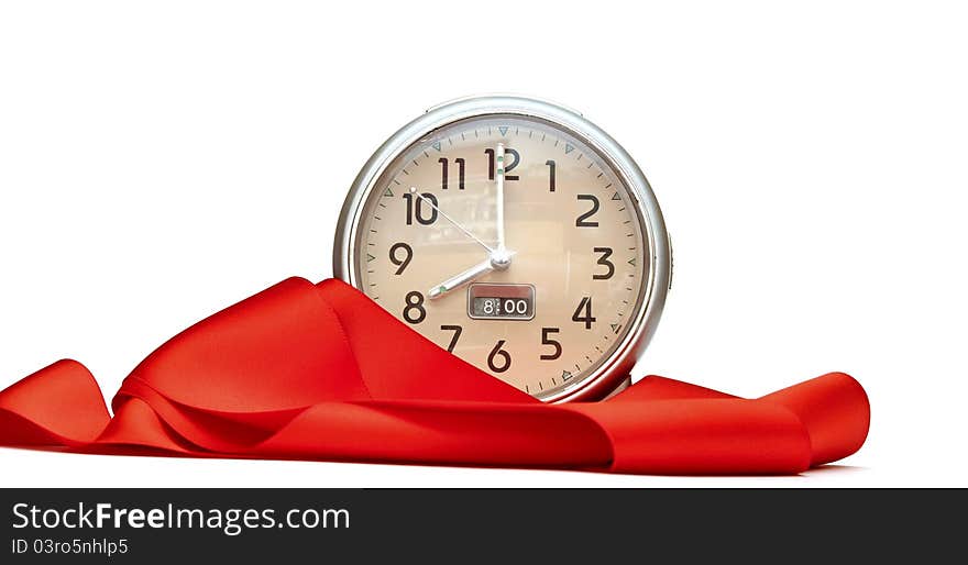 Alarm-clock with red ribbon on white