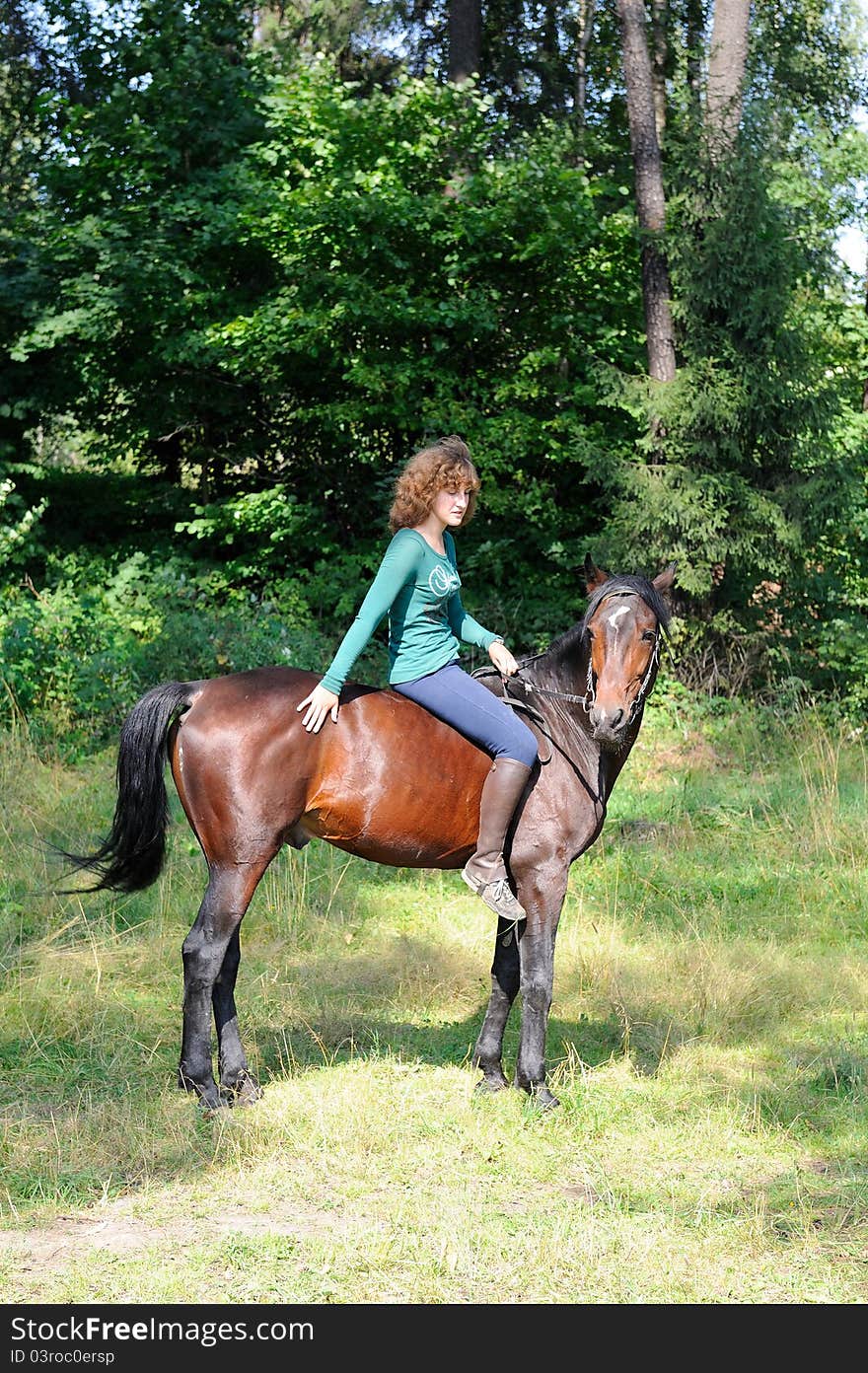 Girl siiting on horseback without saddle. Girl siiting on horseback without saddle