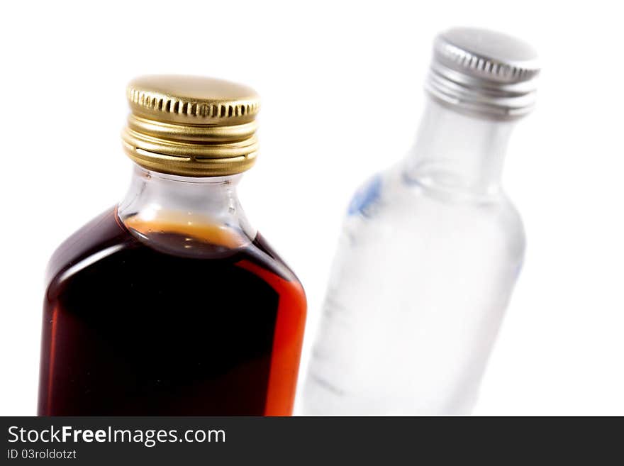 Two bottles on a white background