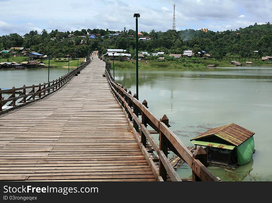 Wooden bridge and floating raft house in Sangklaburi, Thailand