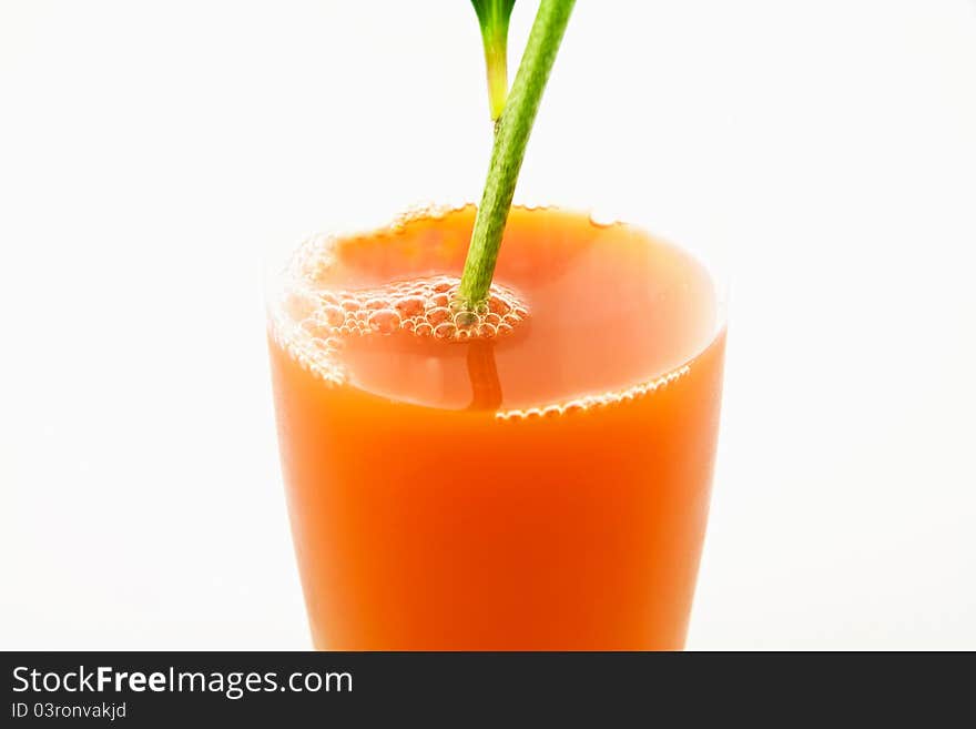 Branch of flower in glass of juice. Branch of flower in glass of juice