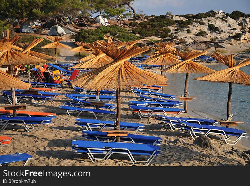 Umbrellas and deck chairs on the sandy beach