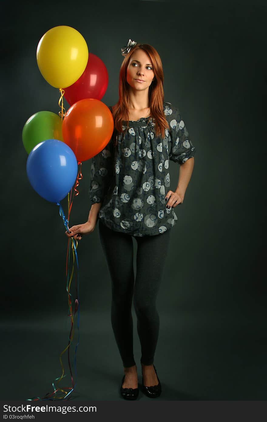 Woman with balloons on grey background. Woman with balloons on grey background