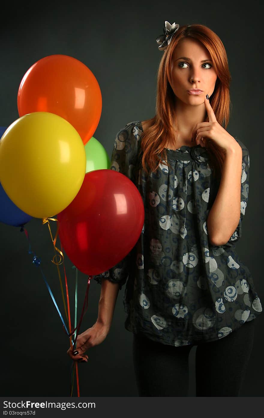 Woman with balloons on grey background. Woman with balloons on grey background