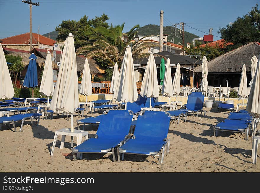 Umbrellas and deck chairs on the sandy beach