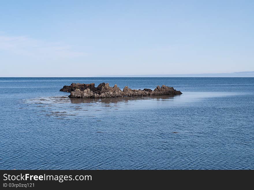 Rocks in the sea of â€‹â€‹the peninsula in Iceland vatnsness. Rocks in the sea of â€‹â€‹the peninsula in Iceland vatnsness