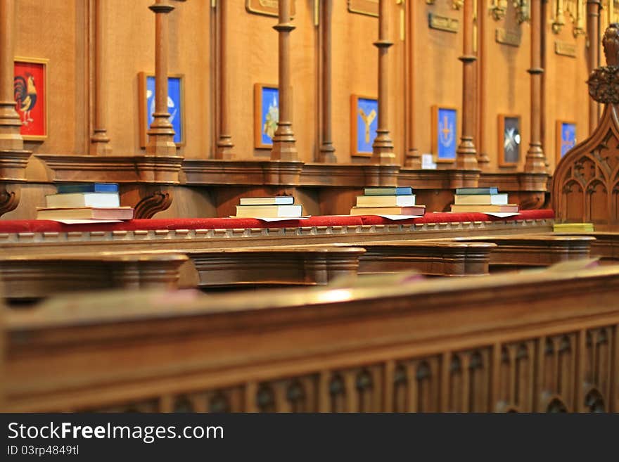 A row of bibles in a cathedral. A row of bibles in a cathedral