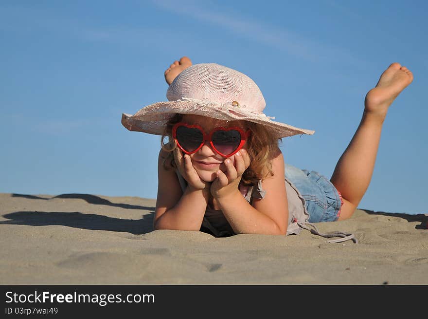 Beautiful girl on the sand