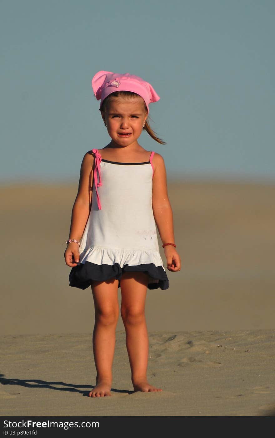 Beautiful girl on the sand