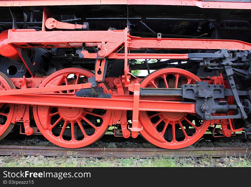 Red iron wheel of a steam engine