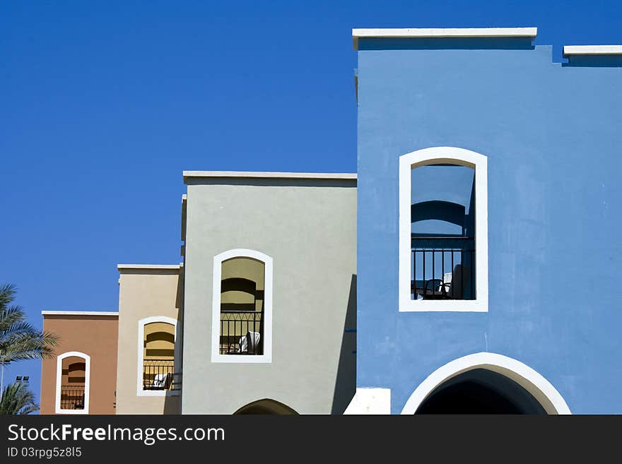 Nice blue hotel in Egypt with clear sky. Summer vacation concept.