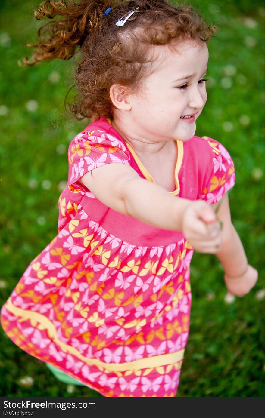 Cute girl having fun in a park. Cute girl having fun in a park