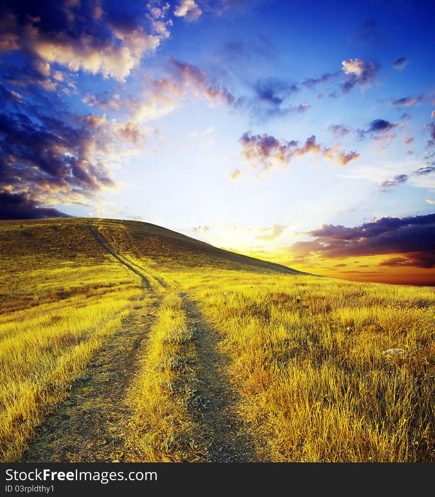 Path on mountain meadow in nice day