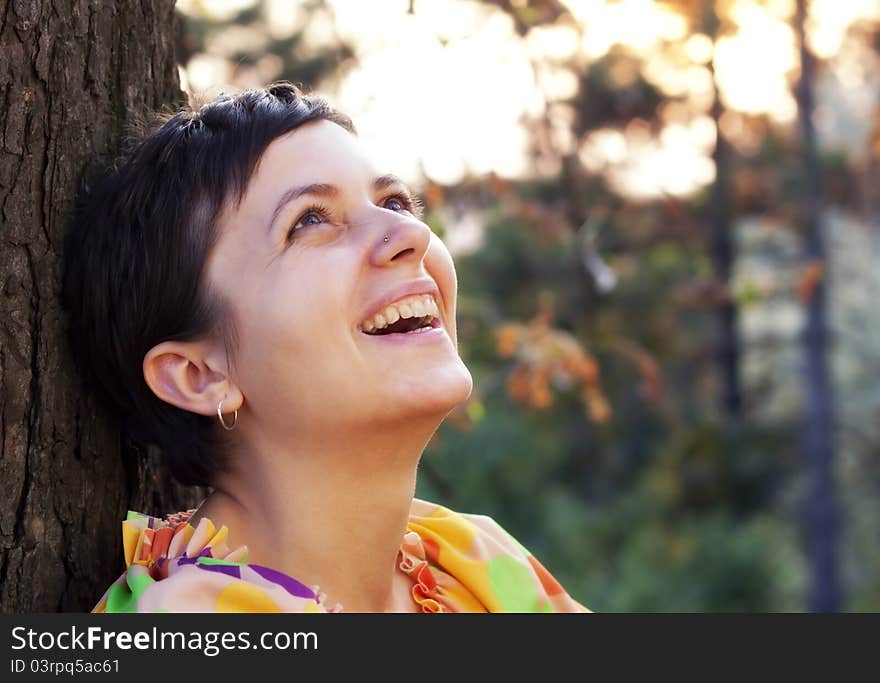 Beautiful woman in autumn park