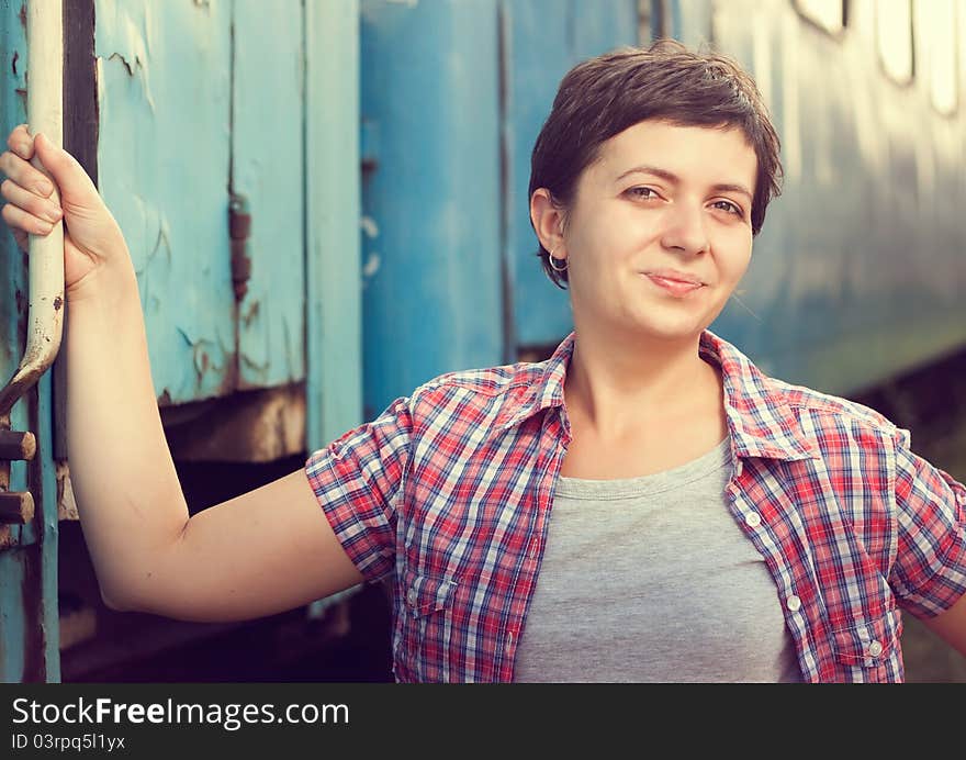 Young woman near train