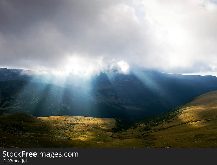 Mountain landscape with sun rays