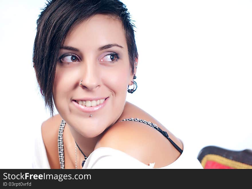 Happy brunette teenager girl with rock attitude on white background. Happy brunette teenager girl with rock attitude on white background