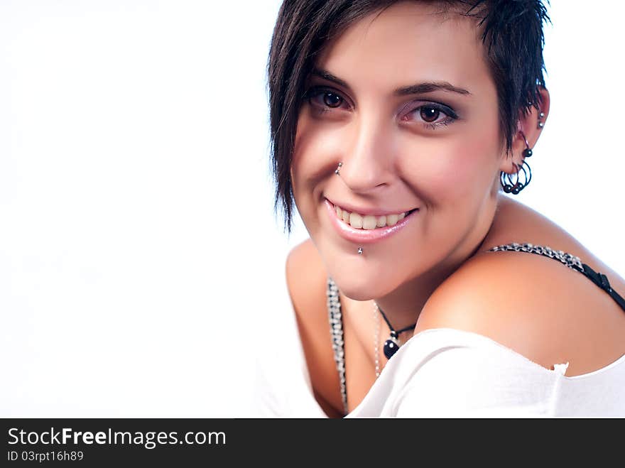 Happy brunette teenager girl with rock attitude on white background. Happy brunette teenager girl with rock attitude on white background