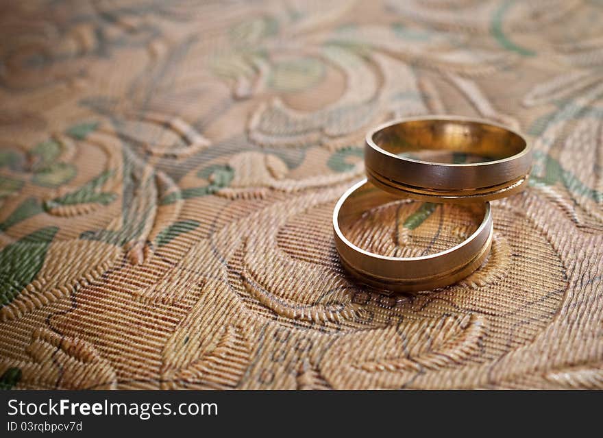 Wedding rings on abstract background