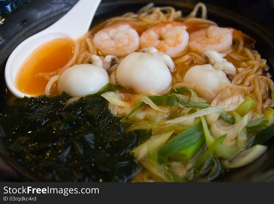 Noodles in a cup of black.