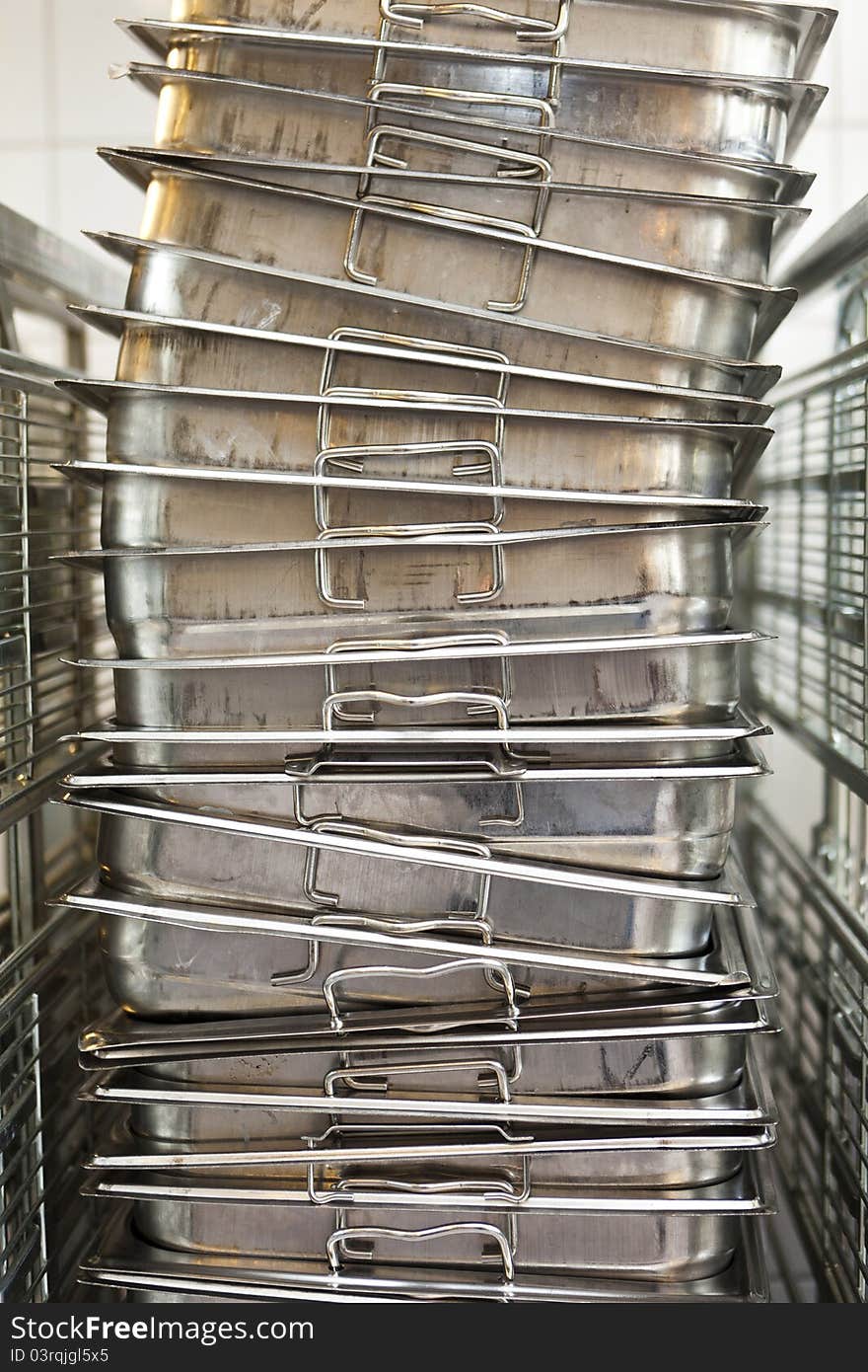 Stack of kitchen utensils at a catering etablishment