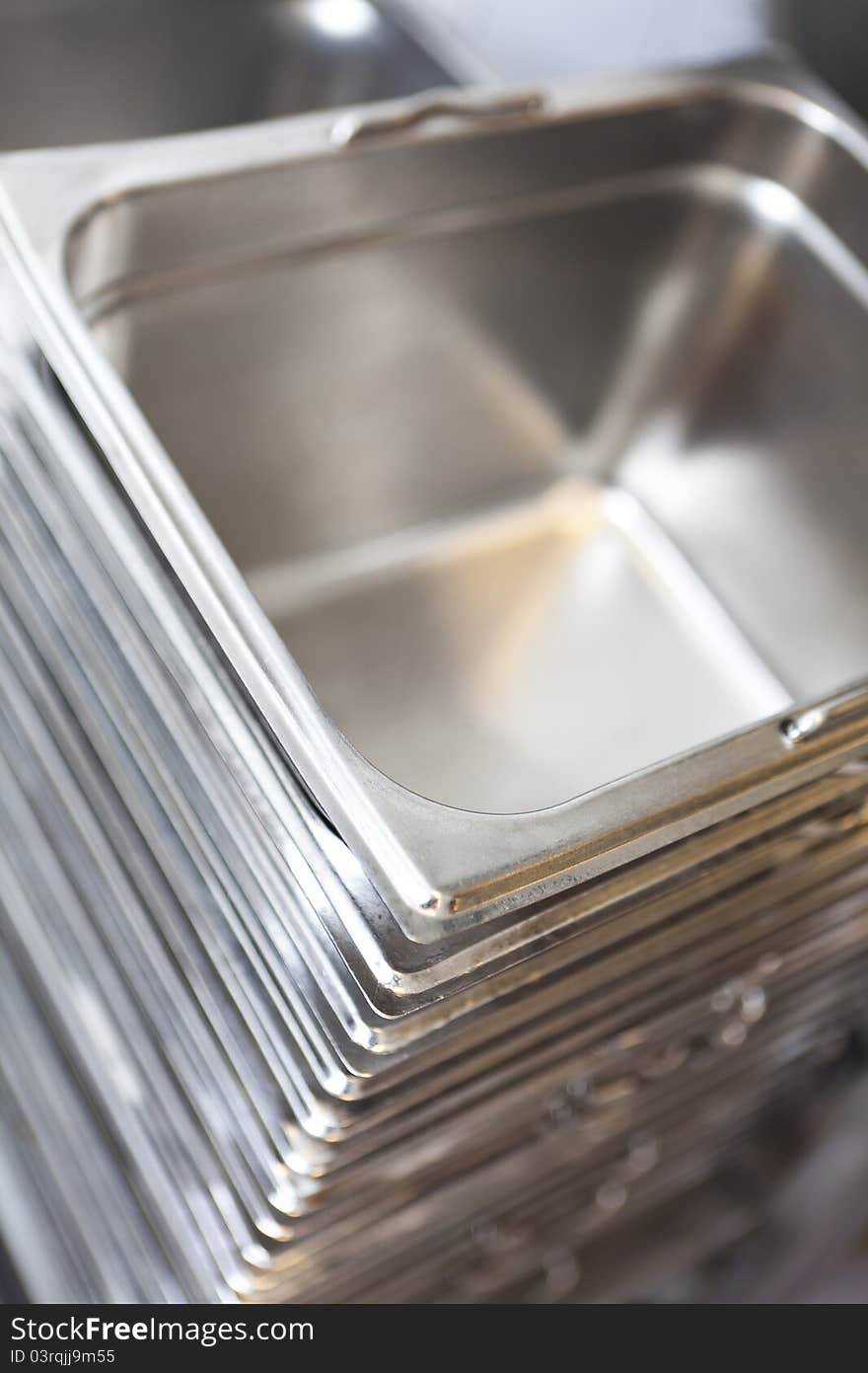 Stack of kitchen utensils at a catering etablishment