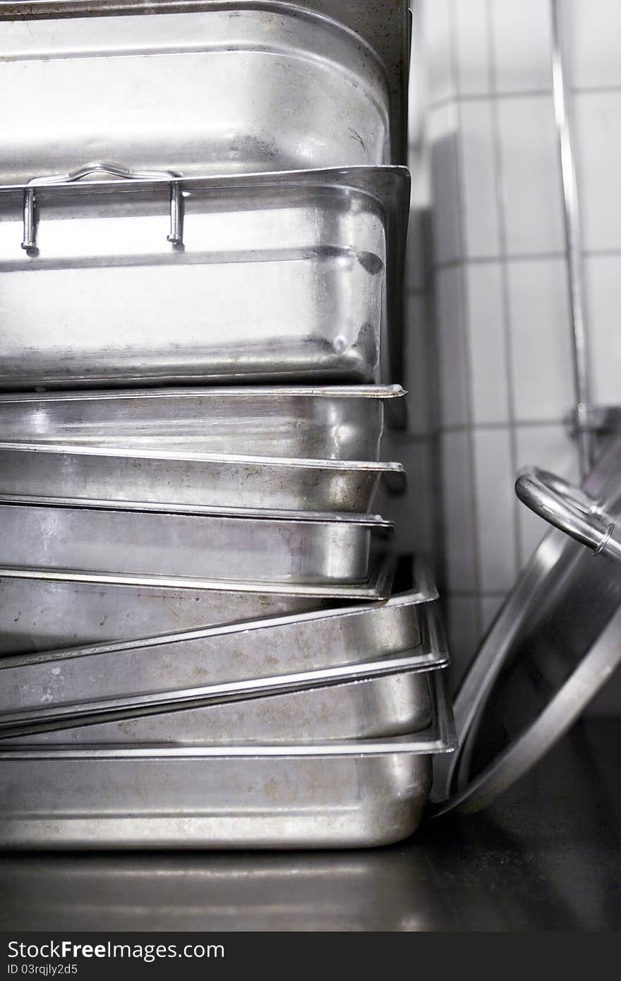 Stack of kitchen utensils at a catering etablishment