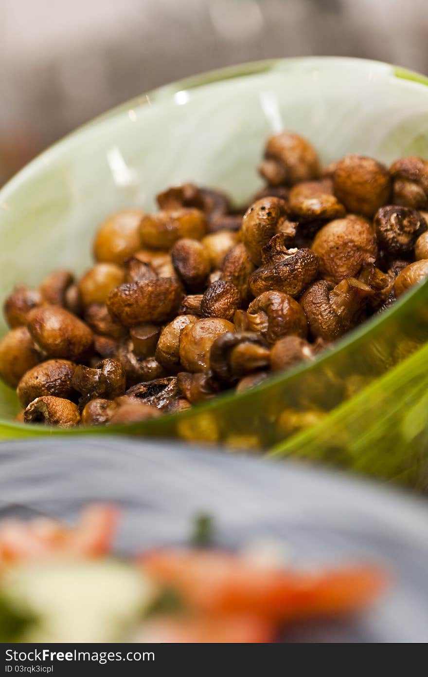 Plate of brown fried champignons