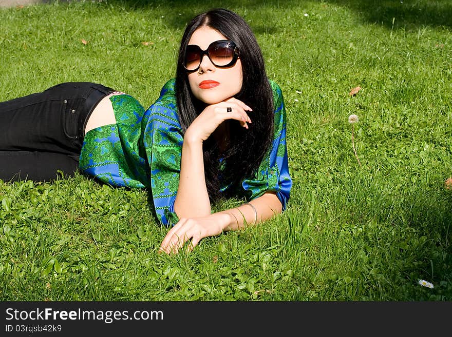 Girl lying on grass in park