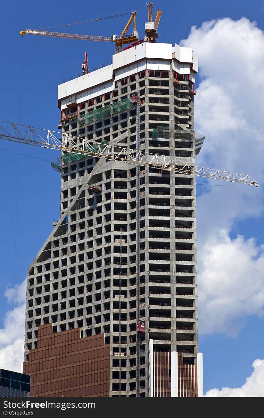 Building a skyscraper on blue sky background. Building a skyscraper on blue sky background.