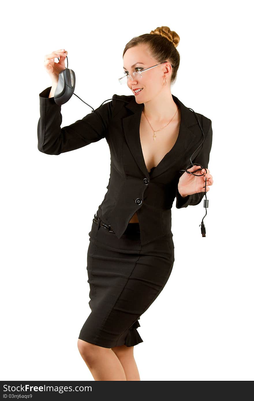 Beautiful girl in business suit looking at the computer mouse isolated on white background. Beautiful girl in business suit looking at the computer mouse isolated on white background