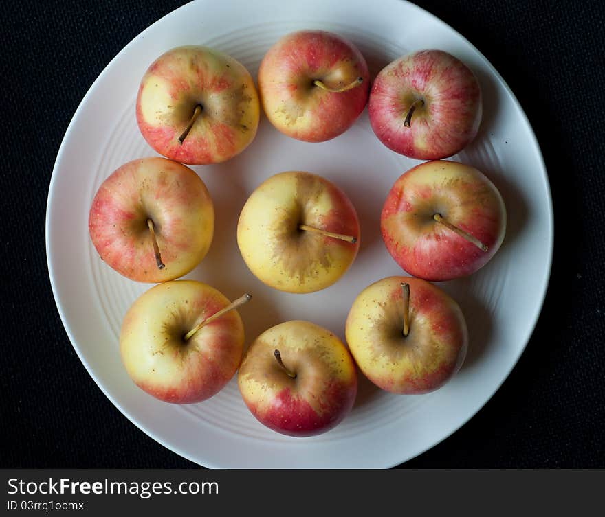 Nine apple on black table. Nine apple on black table