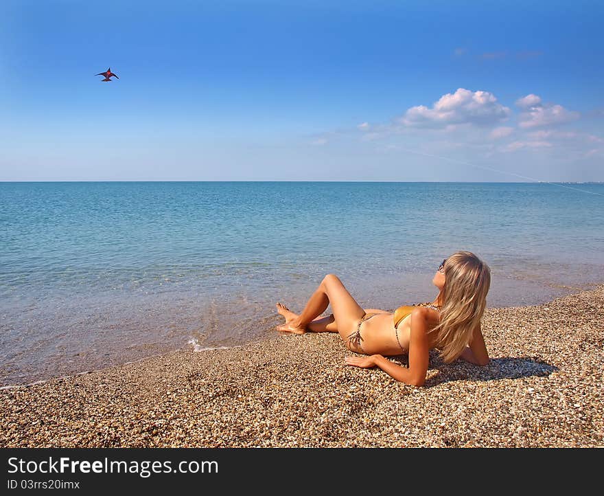 Beautiful girl relaxing on a summer beach