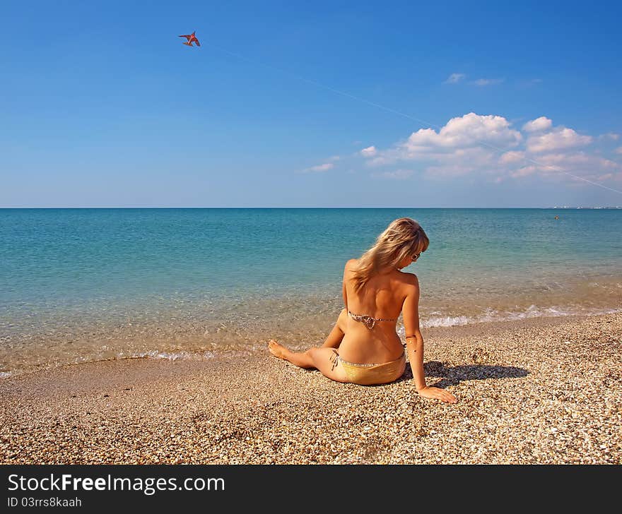 Beautiful Girl Relaxing On A Beach