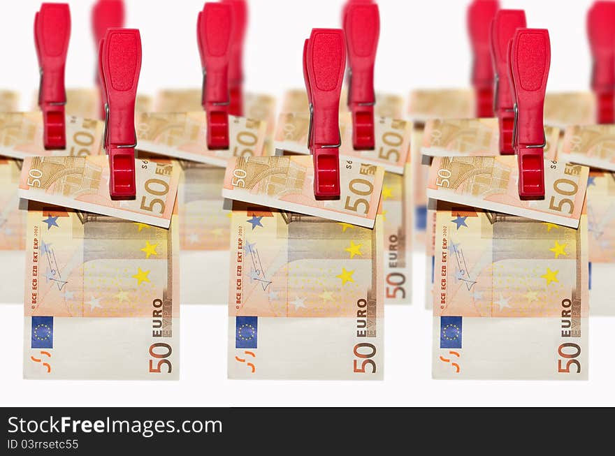 Euro banknotes hanging on clothespins on white background. Euro banknotes hanging on clothespins on white background