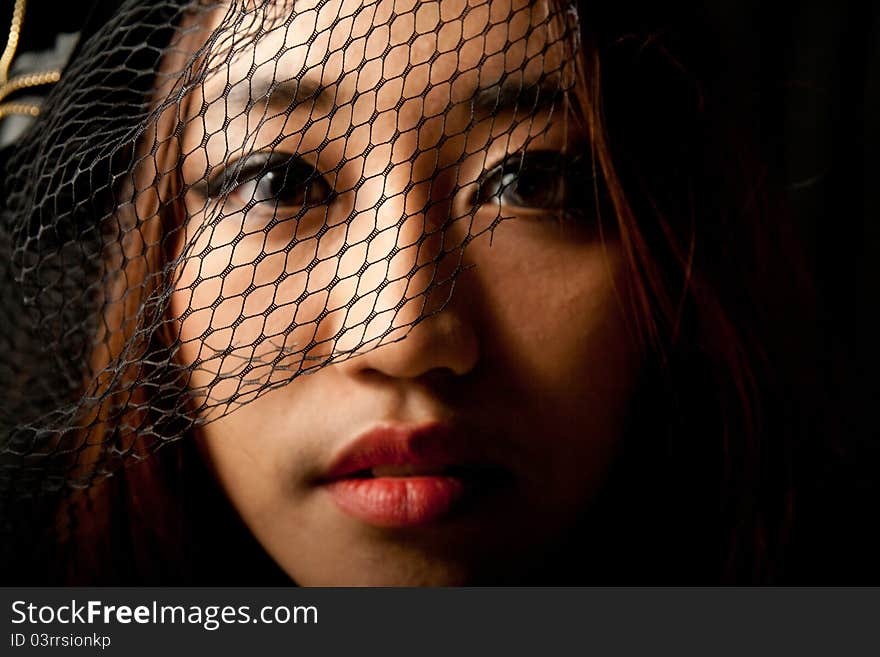 Beautiful young Asian female low key in black dress. Beautiful young Asian female low key in black dress