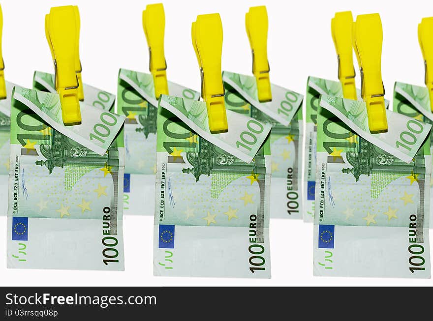 Euro banknotes hanging on clothespins on white background. Euro banknotes hanging on clothespins on white background