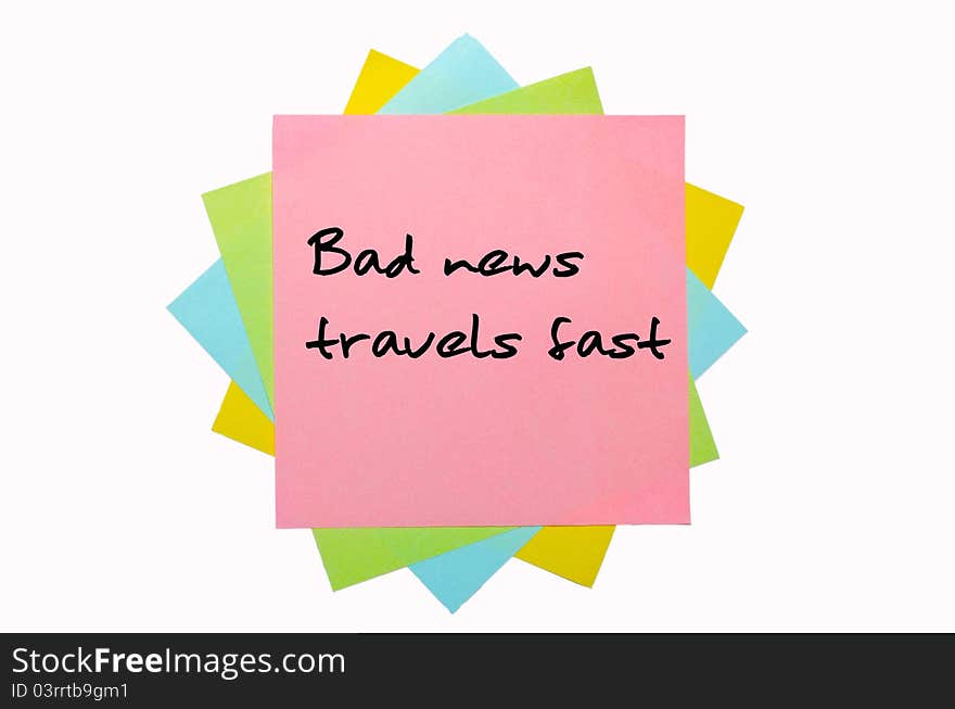 Text Bad news travels fast written by hand font on bunch of colored sticky notes. Text Bad news travels fast written by hand font on bunch of colored sticky notes