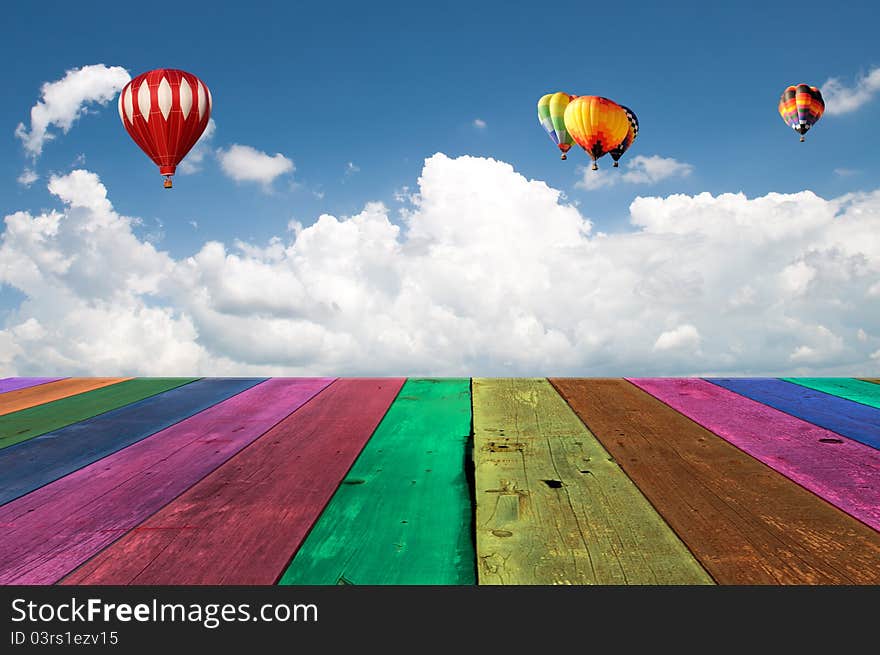 Multi Color wooden wooden view of a cloudy blue sky