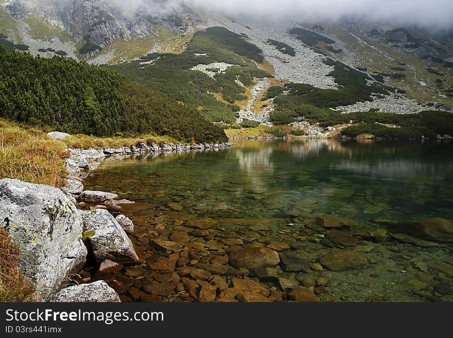 View of the lake in a dill Temnosmrečianske Valley. View of the lake in a dill Temnosmrečianske Valley