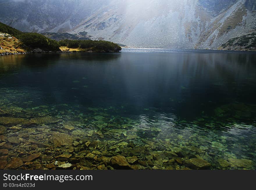 View of the lake in a dill Temnosmrečianske Valley. View of the lake in a dill Temnosmrečianske Valley