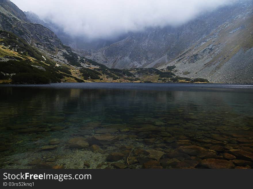 View of the lake in a dill Temnosmrečianske Valley. View of the lake in a dill Temnosmrečianske Valley