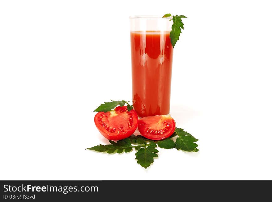 Glass of tomato juice with slices of tomato on white background