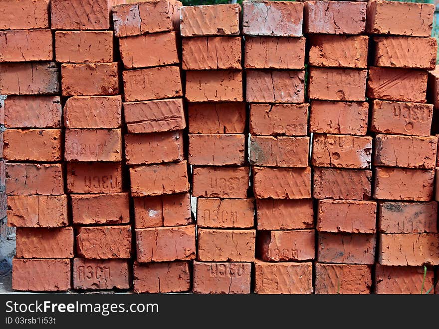 Building blocks stacked in rows of red. Building blocks stacked in rows of red