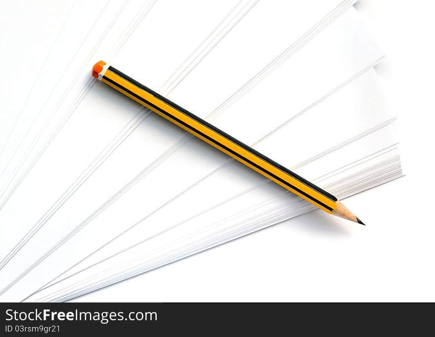 Pencil lying on a clean white paper. Pencil lying on a clean white paper