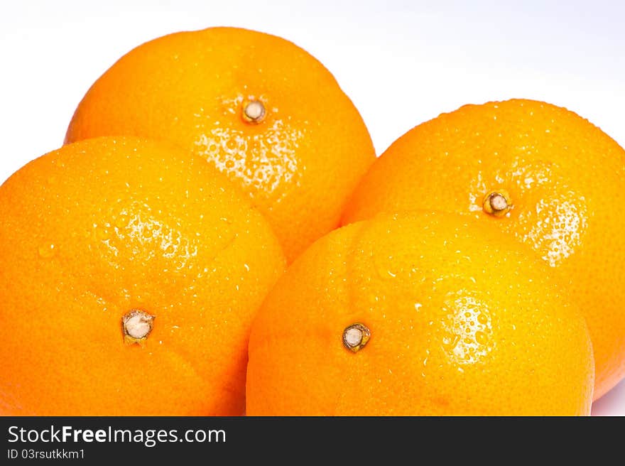 Four ripe oranges