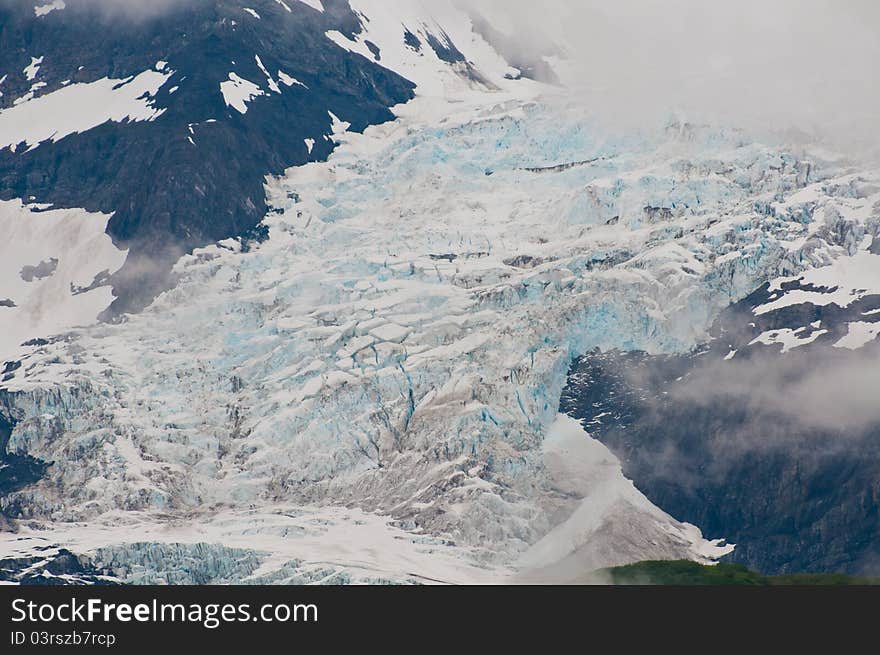 Closeup shot of huge glaciers in mountain valleys showing texture and detail. Closeup shot of huge glaciers in mountain valleys showing texture and detail.