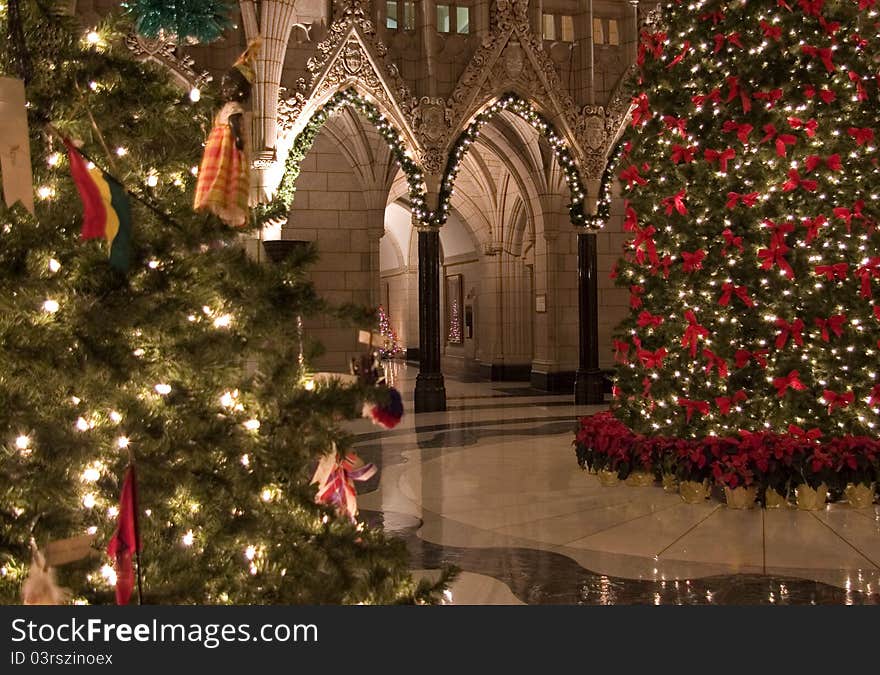 The Canadian Parliament Rotunda decorated for Christmas with two beautiful trees. The Canadian Parliament Rotunda decorated for Christmas with two beautiful trees.